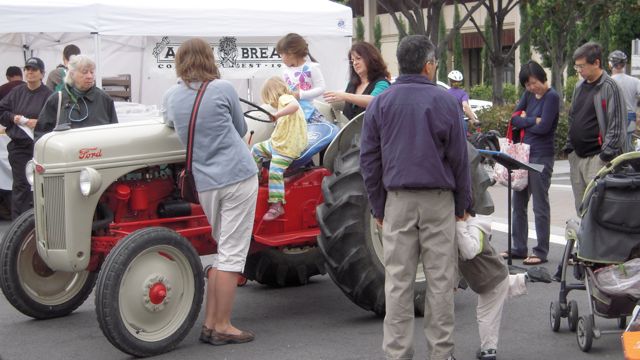 Crowd around 8N tractor at Farmer's market